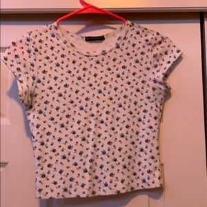 short sleeve top with small blue flowers